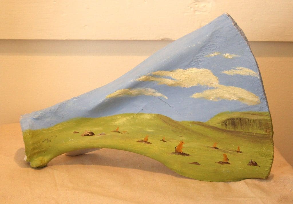 Oil painting by Lise Perrault on bovine scapula, depicting prairie dog colony